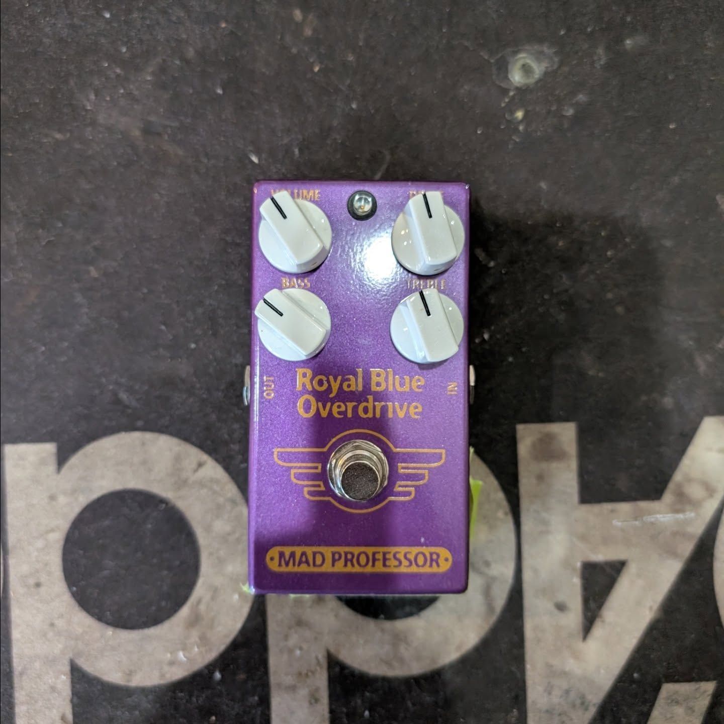Purple Mad Professor Royal Blue Overdrive guitar pedal with four white knobs on a dark surface