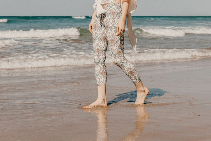 Sally Flower walking on beach