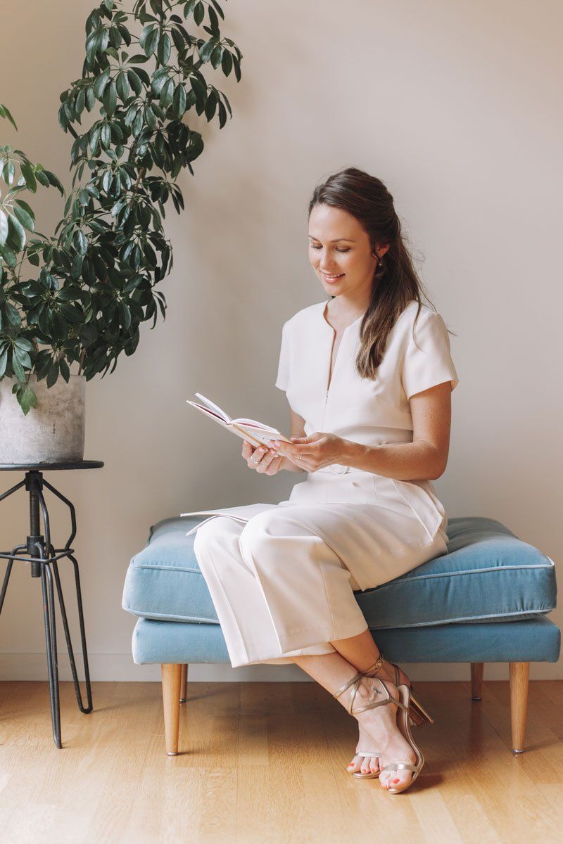 Sally Flower from Home Sanctuary reading KonMari Book on minimalism