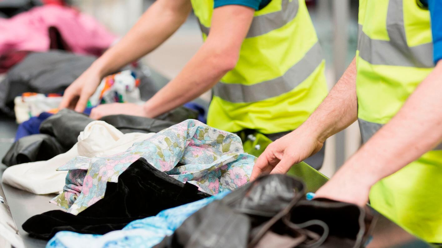 Workers organising textile clothes recycle