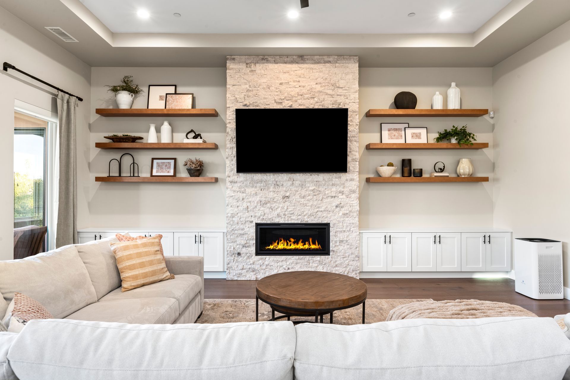 Staged Ritchie Street living room with stone fireplace