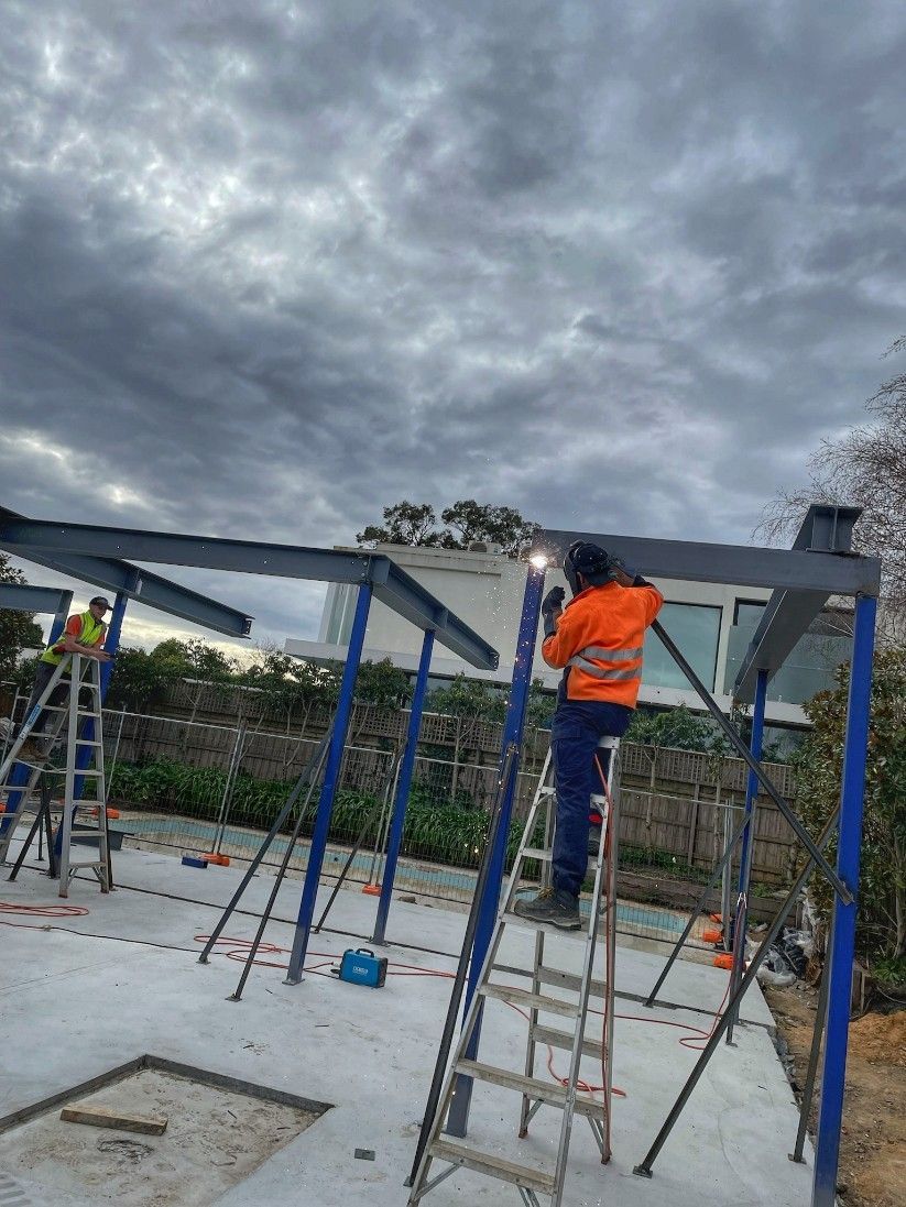 Construction Worker Welding Steel Beams