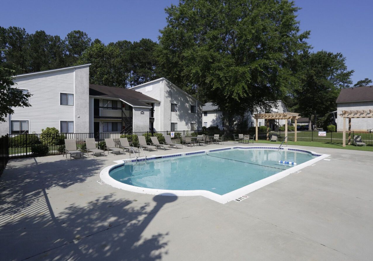 A large swimming pool in front of a building