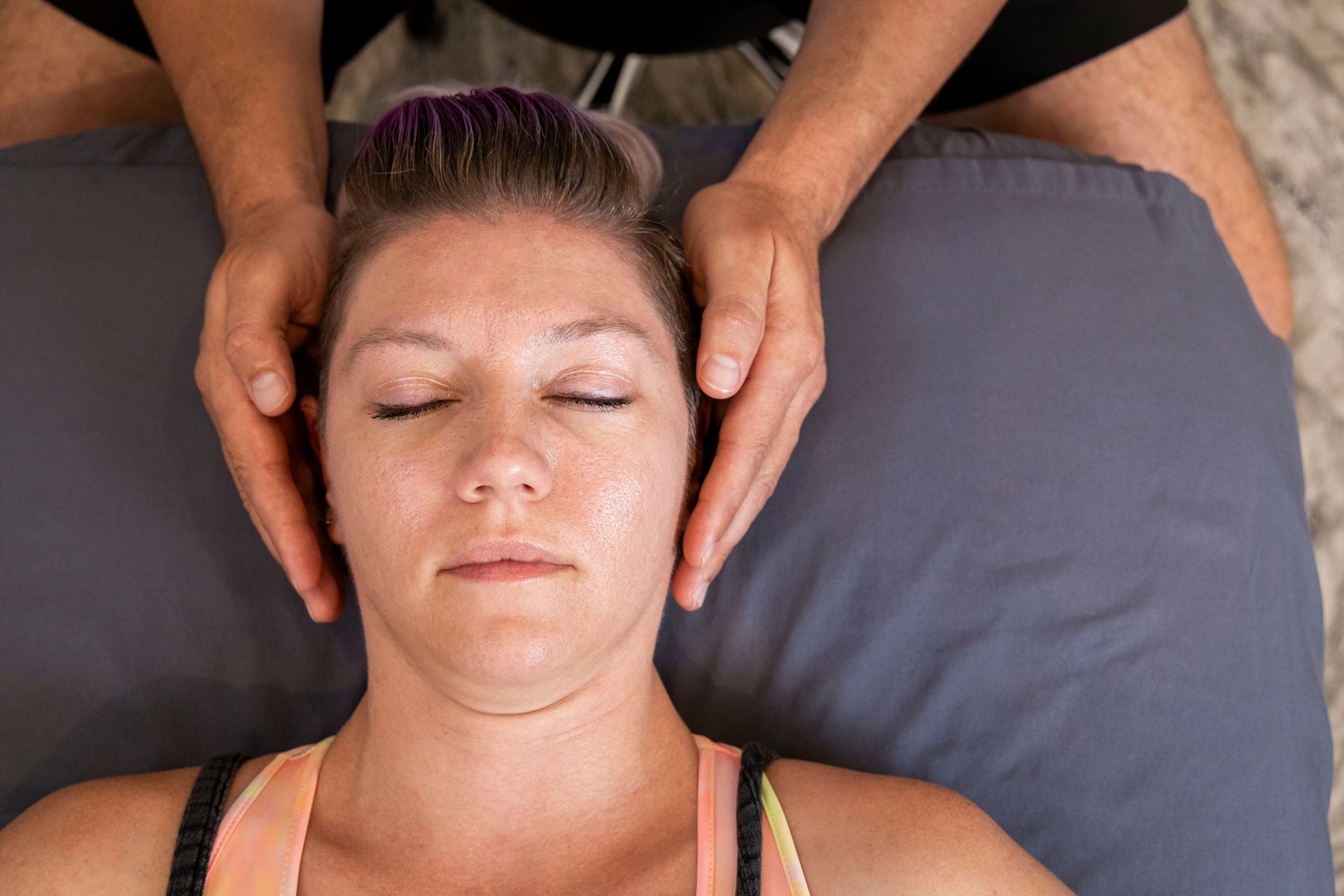 Man receiving Cranial Sacral therapy.