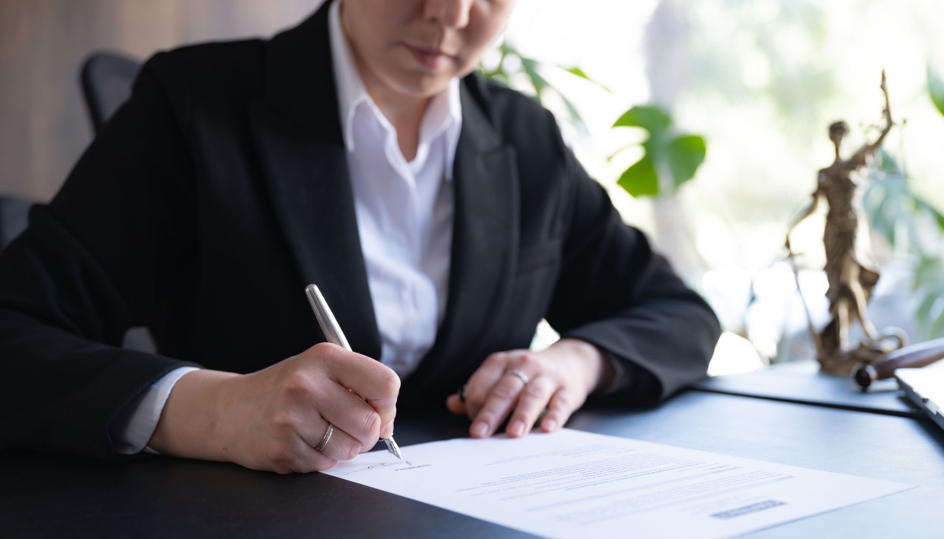 Estate and probate lawyer preparing important paperwork for a client. Estate and probate lawyer preparing important paperwork for a client.