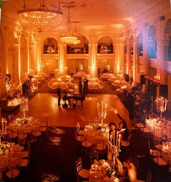 A large room filled with tables and chairs and candles