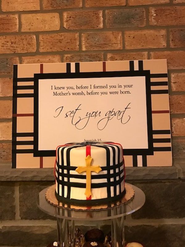 A plaid cake with a yellow cross on it