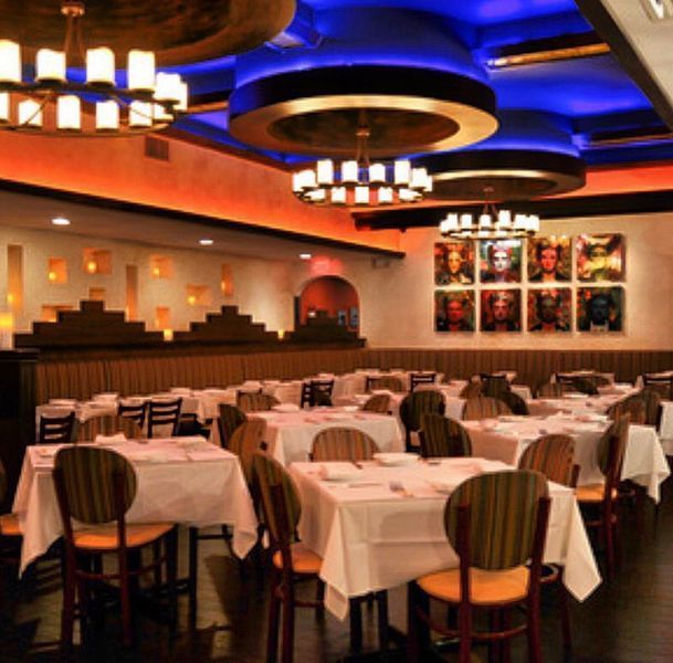 A large dining room with many tables and chairs