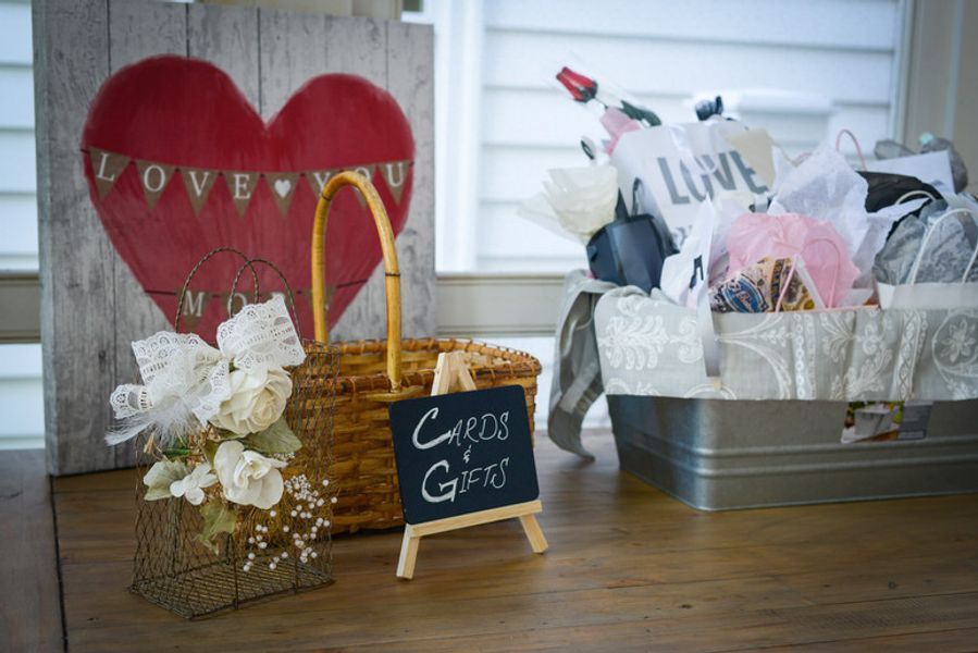 A table with a basket, a sign, and a heart on it.