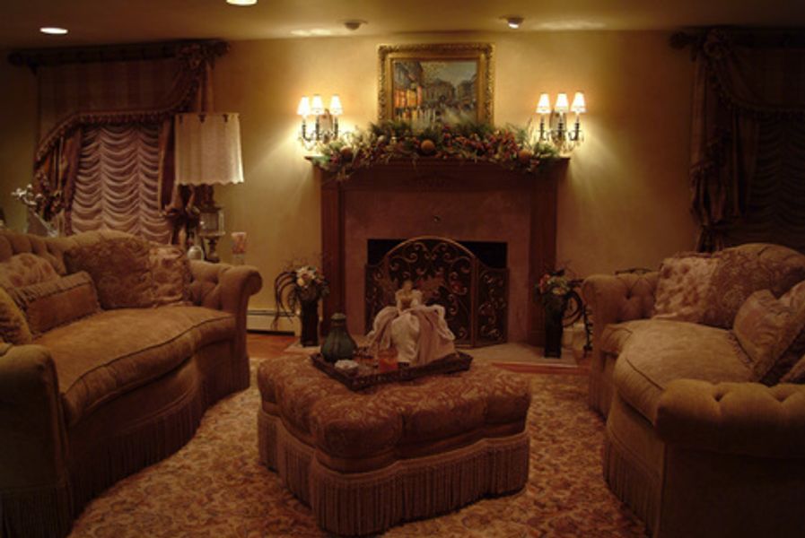 A living room filled with furniture and a fireplace