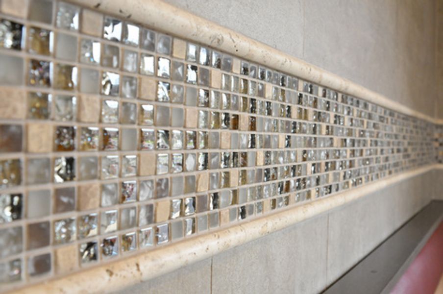 A wall with a row of tiles on it