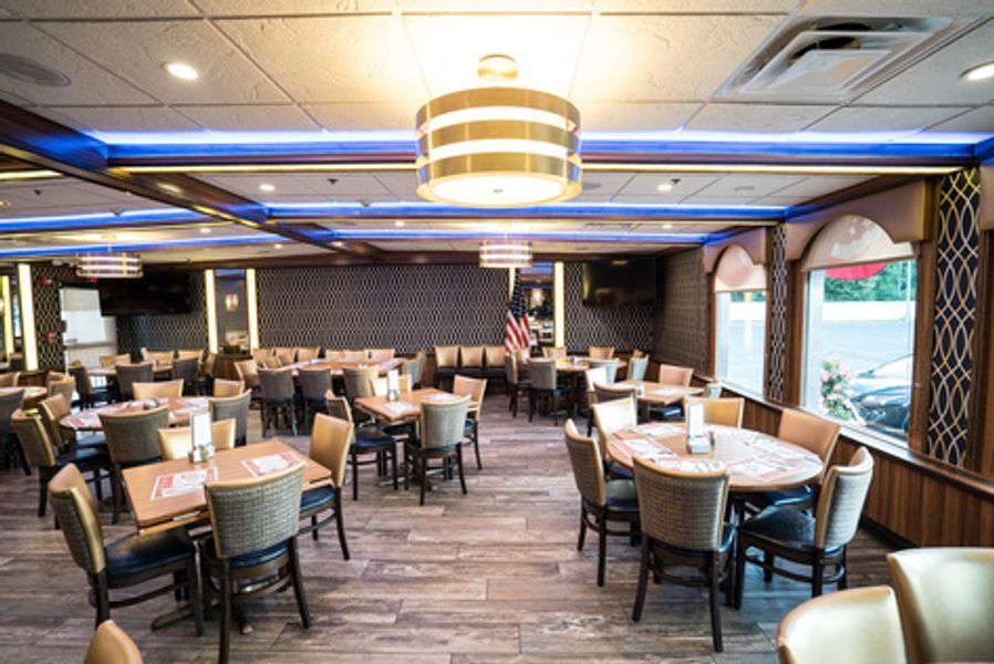 A large dining room filled with tables and chairs