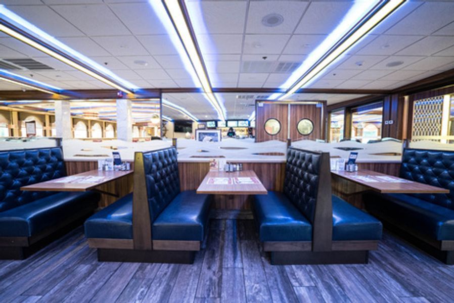 A diner with blue booths and tables