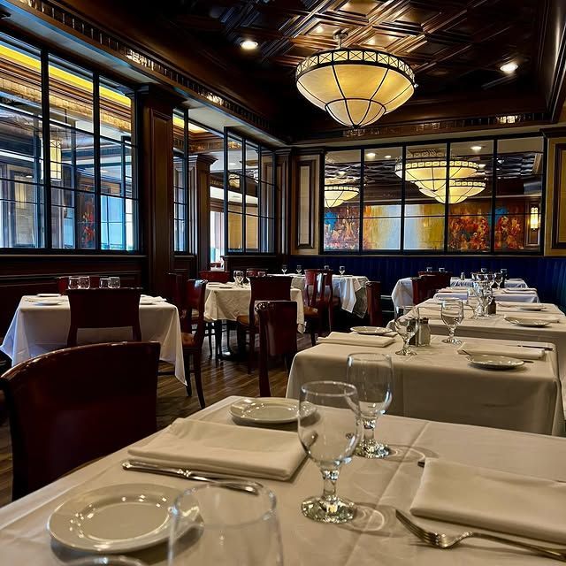 A restaurant with a lot of tables and chairs