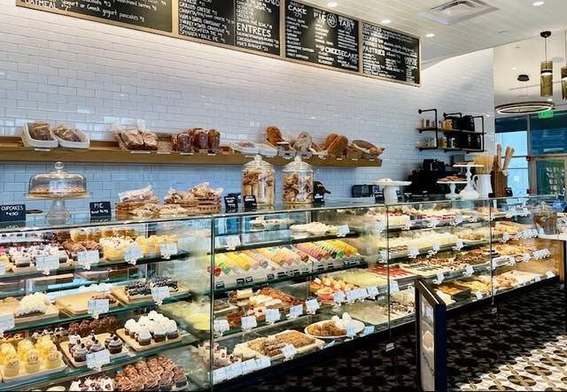 A bakery with a lot of food on display