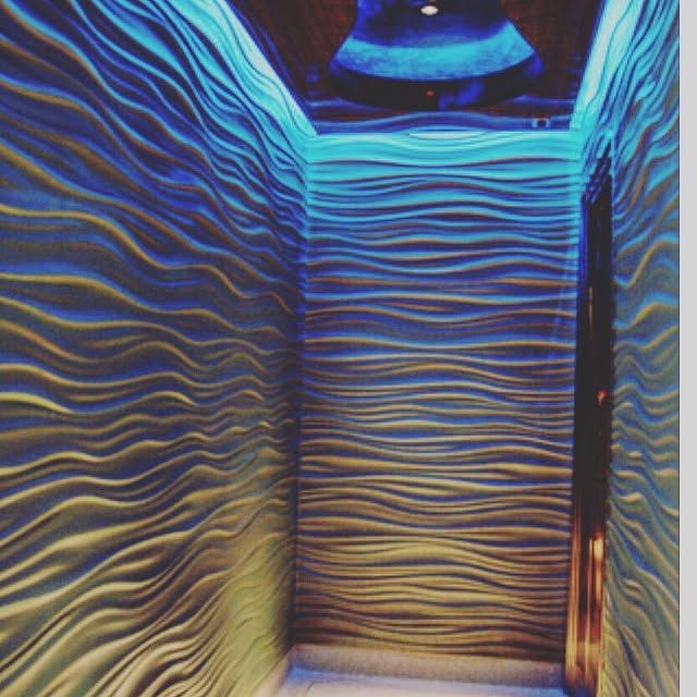 A hallway with a blue light on the ceiling