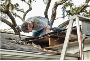 Roofers working on residential home that is leaking in Cheyenne