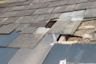 Damaged roof  from thunder storm that needs to be repaired in Cheyenne.