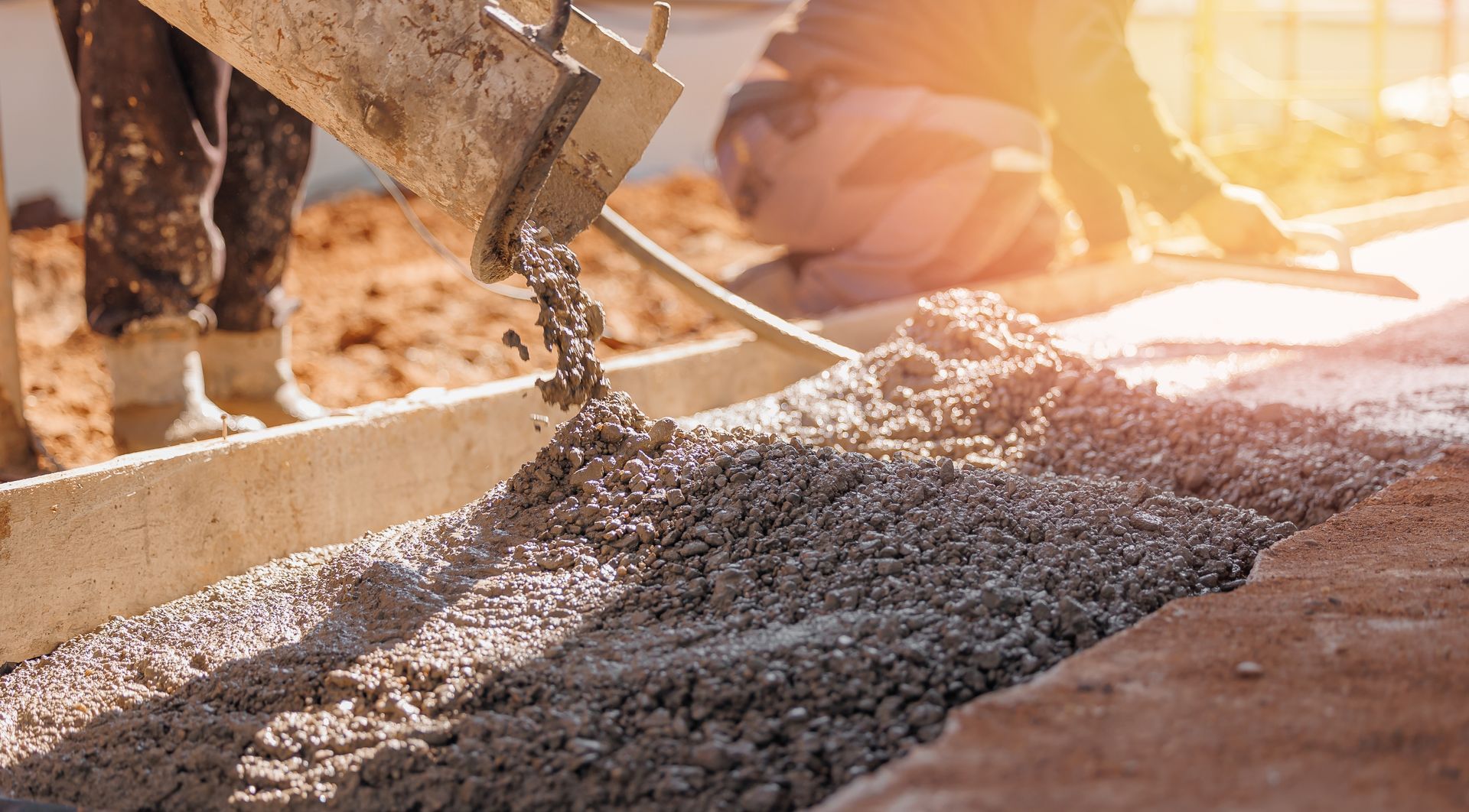 Concrete being poured from a mixer onto a construction site