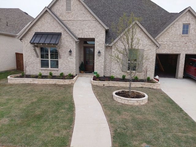 A brick house with a walkway leading to it