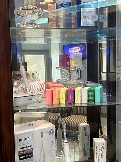 A display case filled with a variety of toothbrushes and toothpaste.