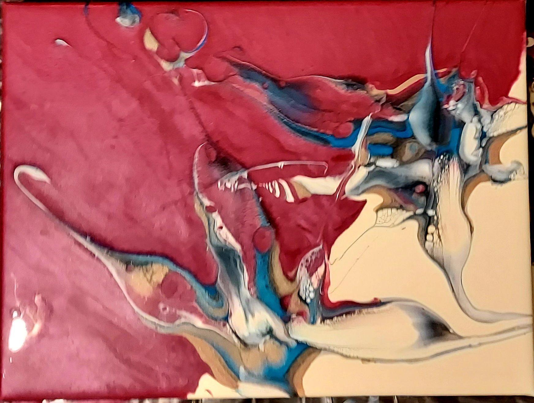 A red white and blue painting on a canvas