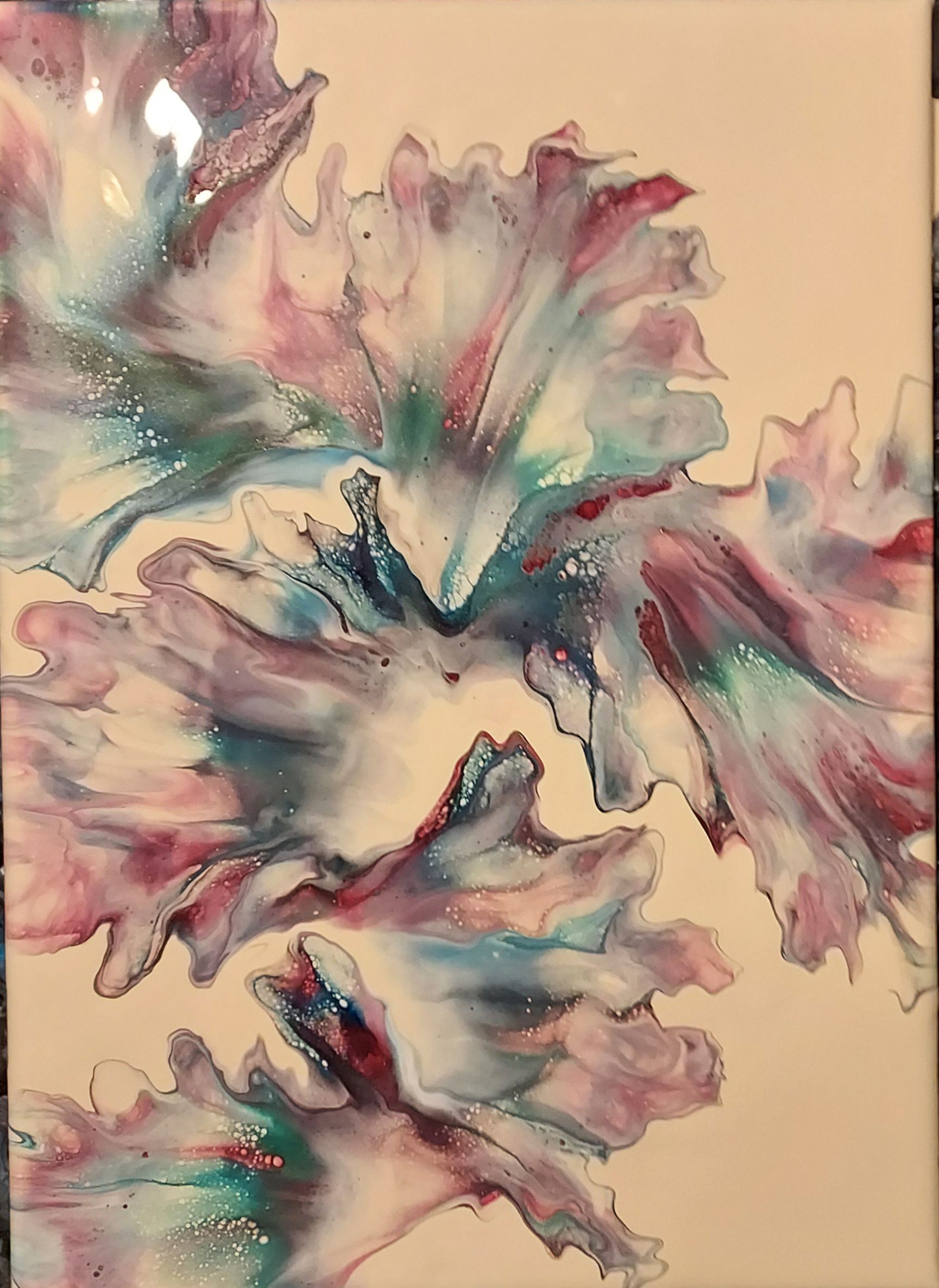 A close up of a painting of a flower on a white background