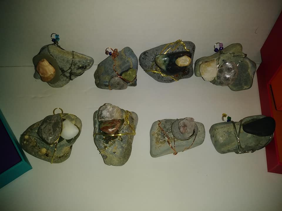 A group of hand wired jewelry stones sitting on top of a table