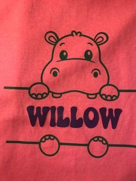 A pink shirt with a hippo and the name willow on it