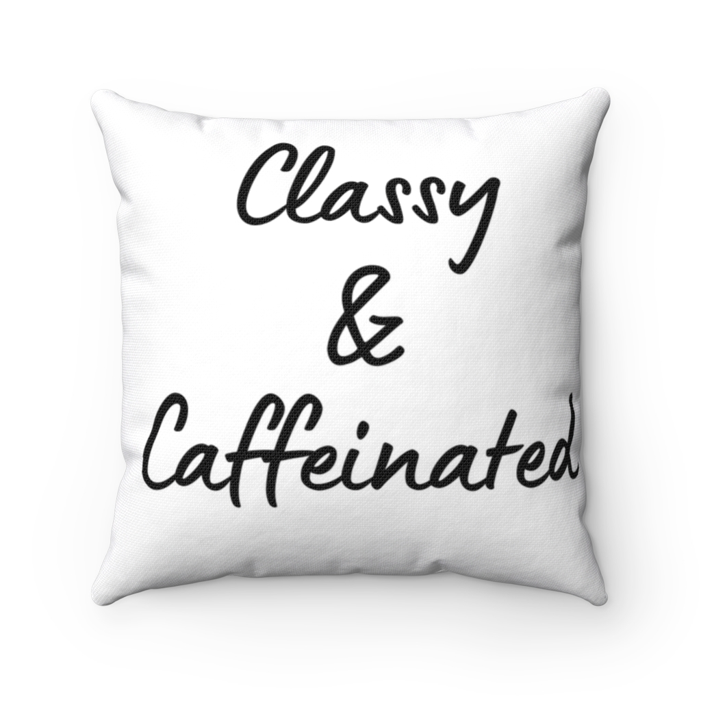 A white pillow with the words `classy & caffeinated '' written on it.