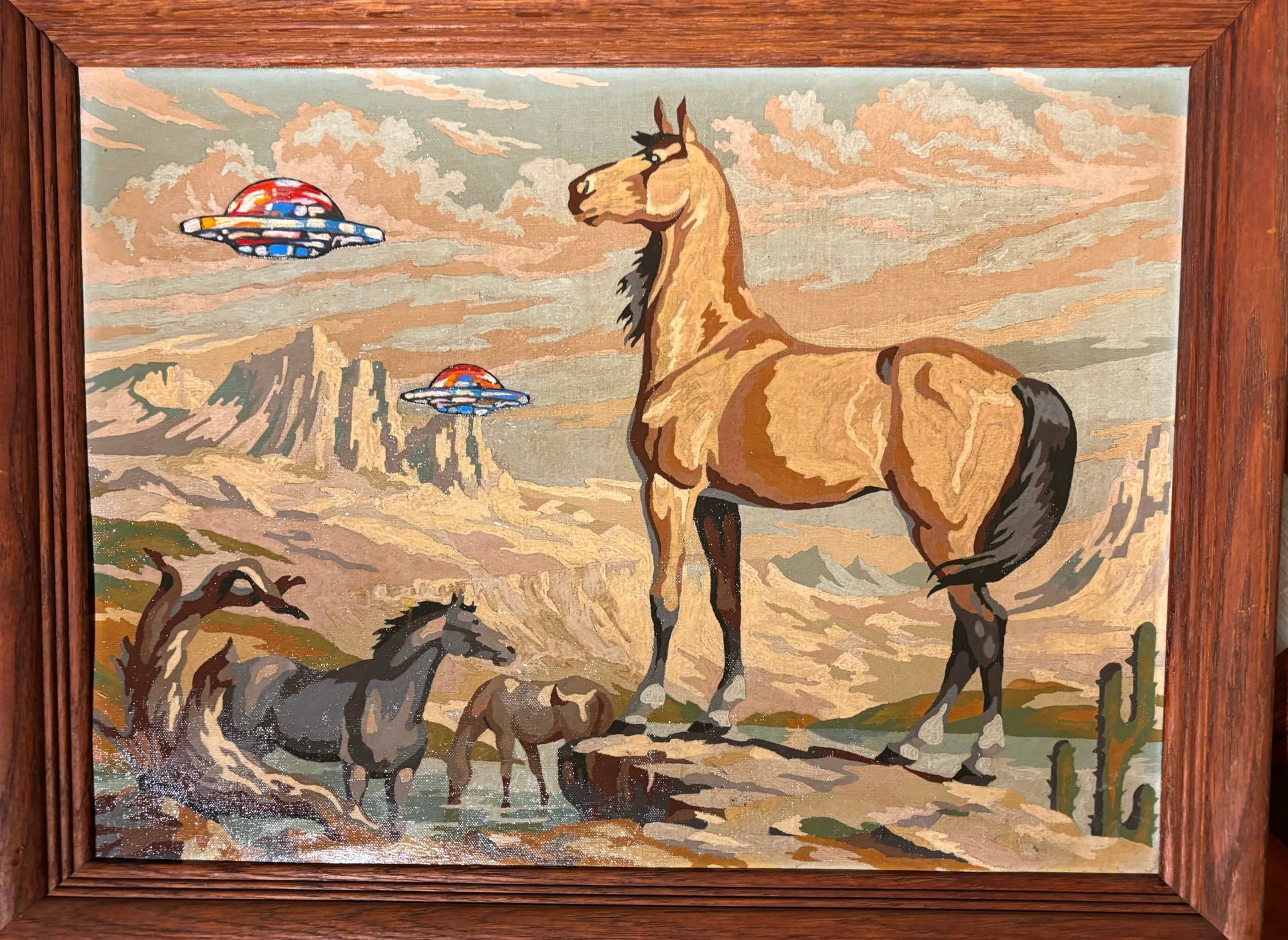 A painting of a horse with a ufo in the background