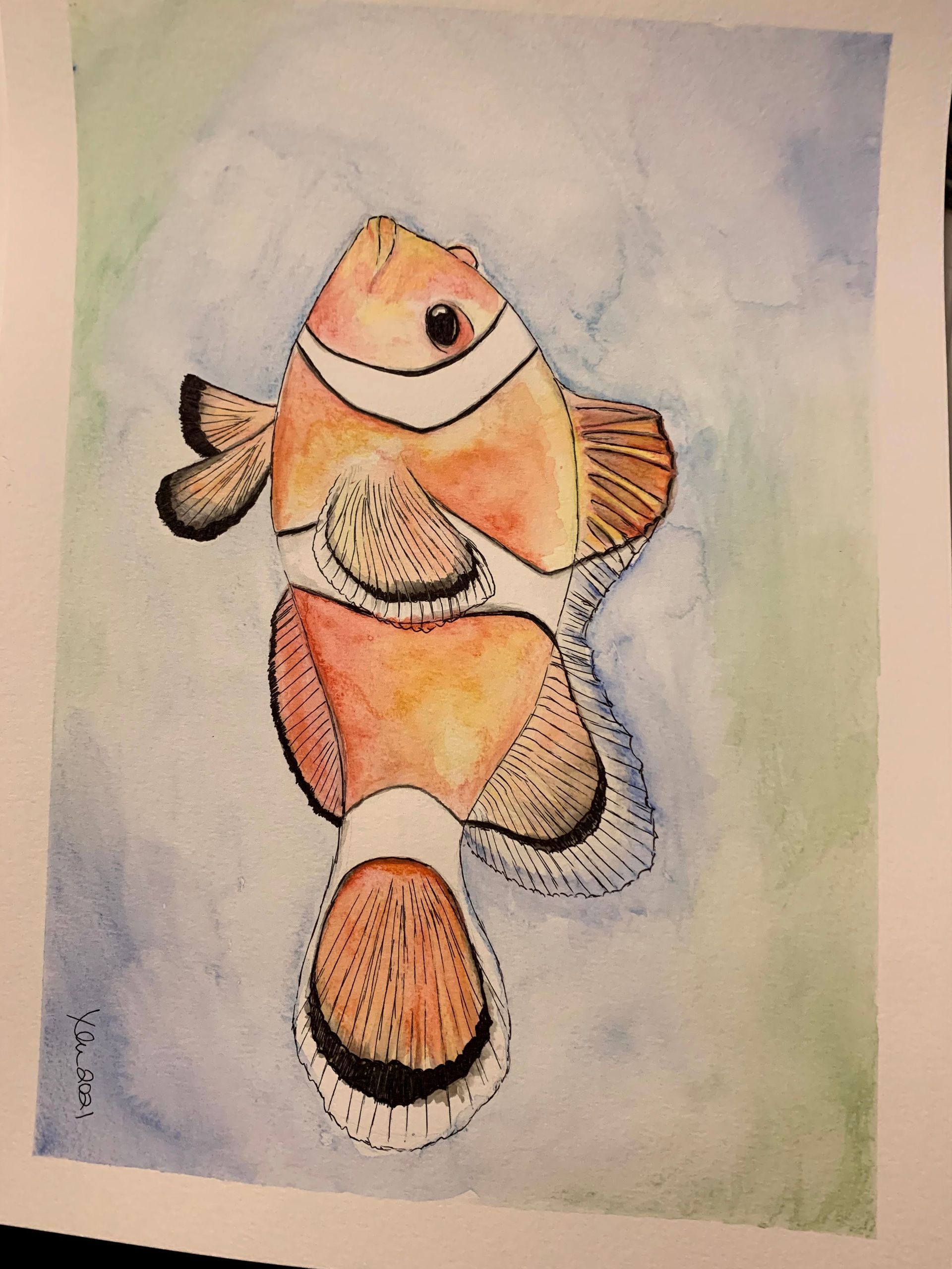 A watercolor painting of a clown fish with a blue background