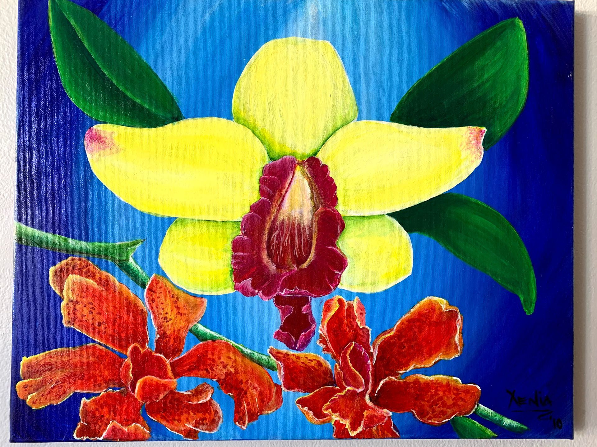 A painting of a yellow orchid with red flowers on a blue background