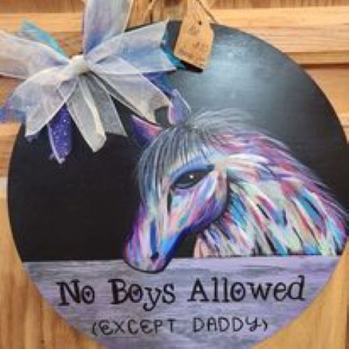 A sign with a horse on it that says `` no boys allowed except daddy ''.