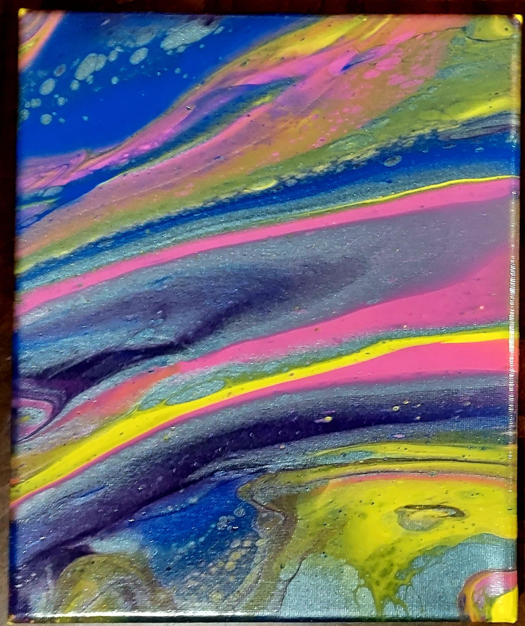 A close up of a colorful painting on a canvas