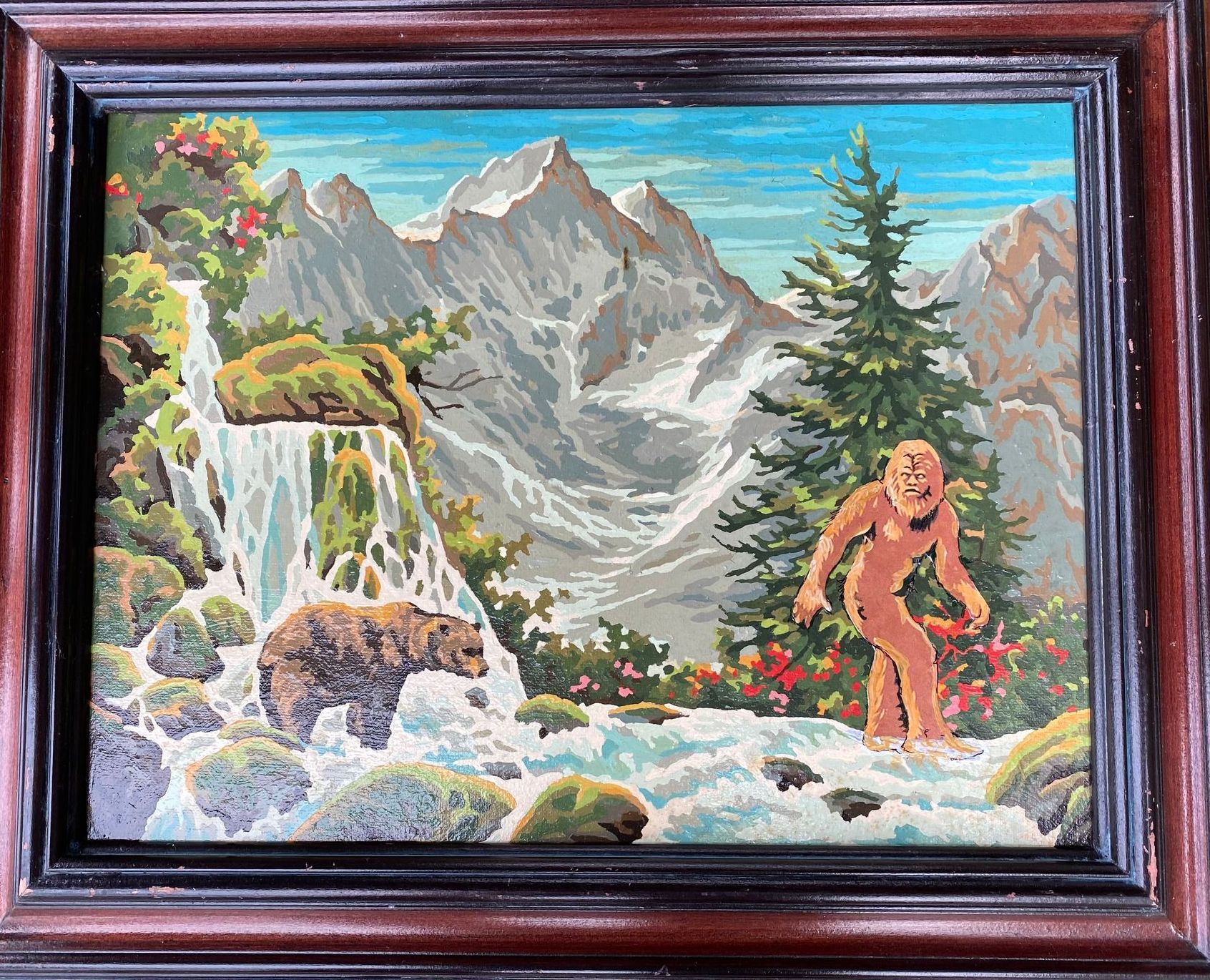 A painting of a mountain landscape with a bear crossing a river and Big Foot is looking at the bear