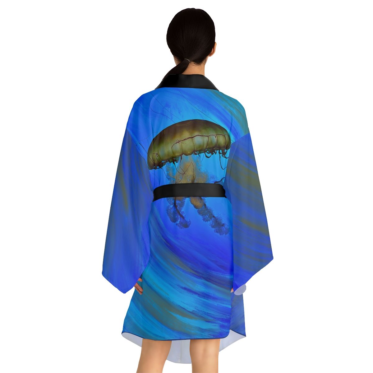 A woman is wearing a blue robe with a jellyfish on the back