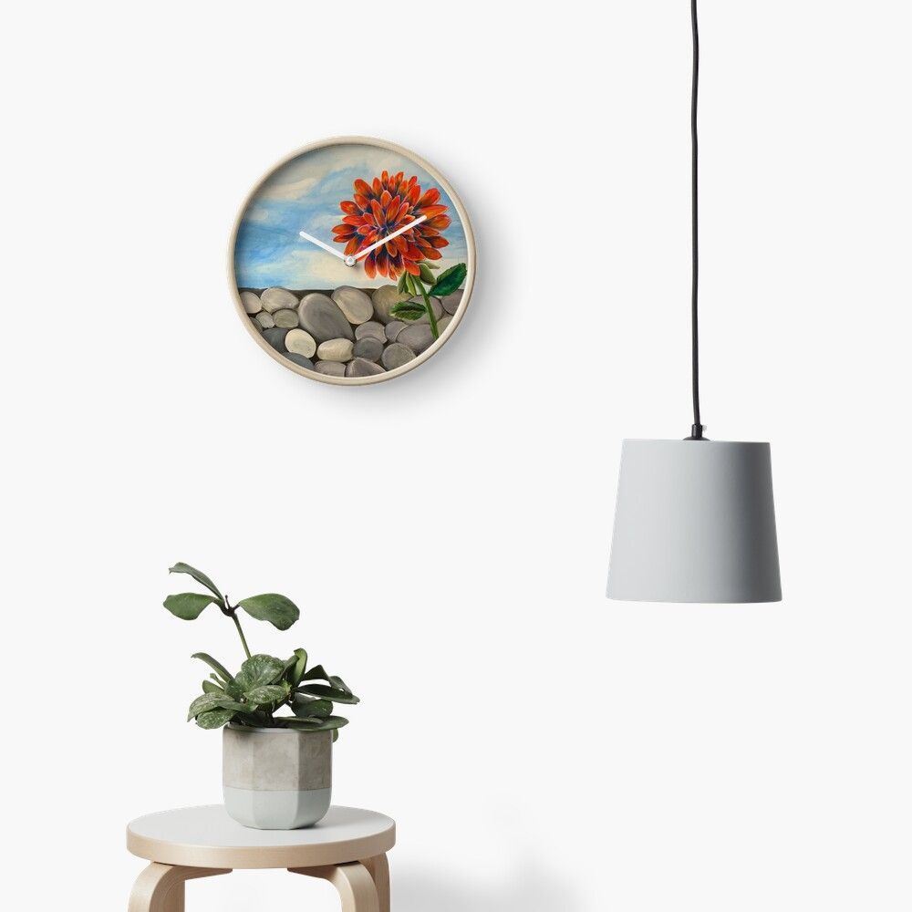 A clock with a picture of a flower on it