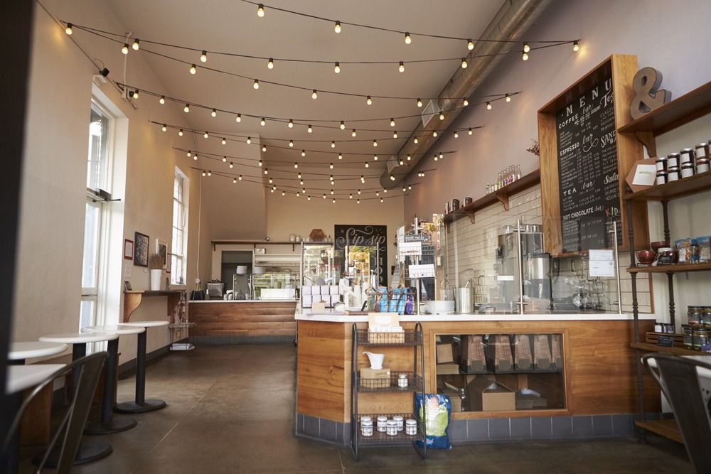 An Empty Restaurant With Tables And Chairs And A Counter — Café and Restaurant in Whitsundays, QLD