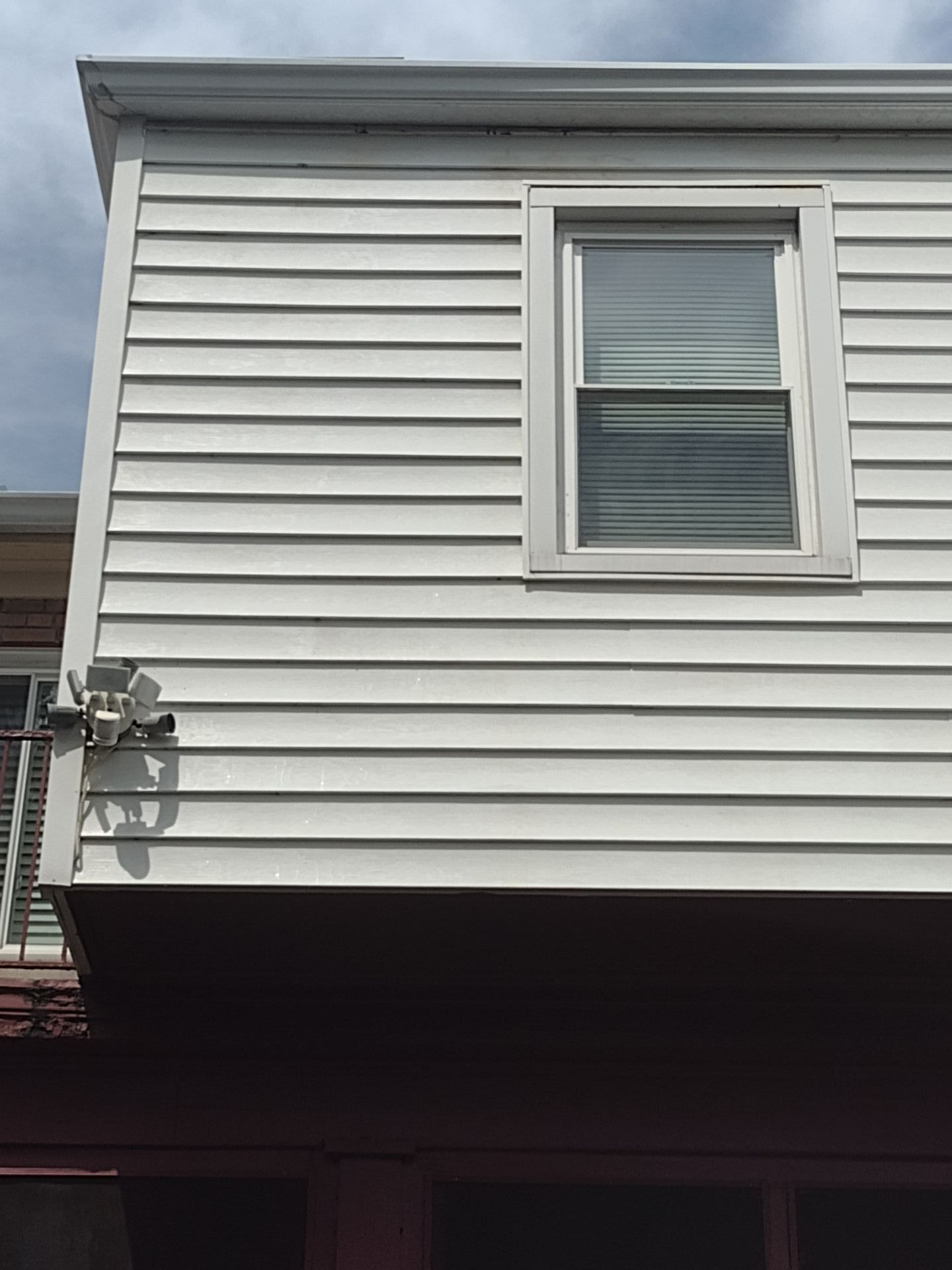 Power washing a house