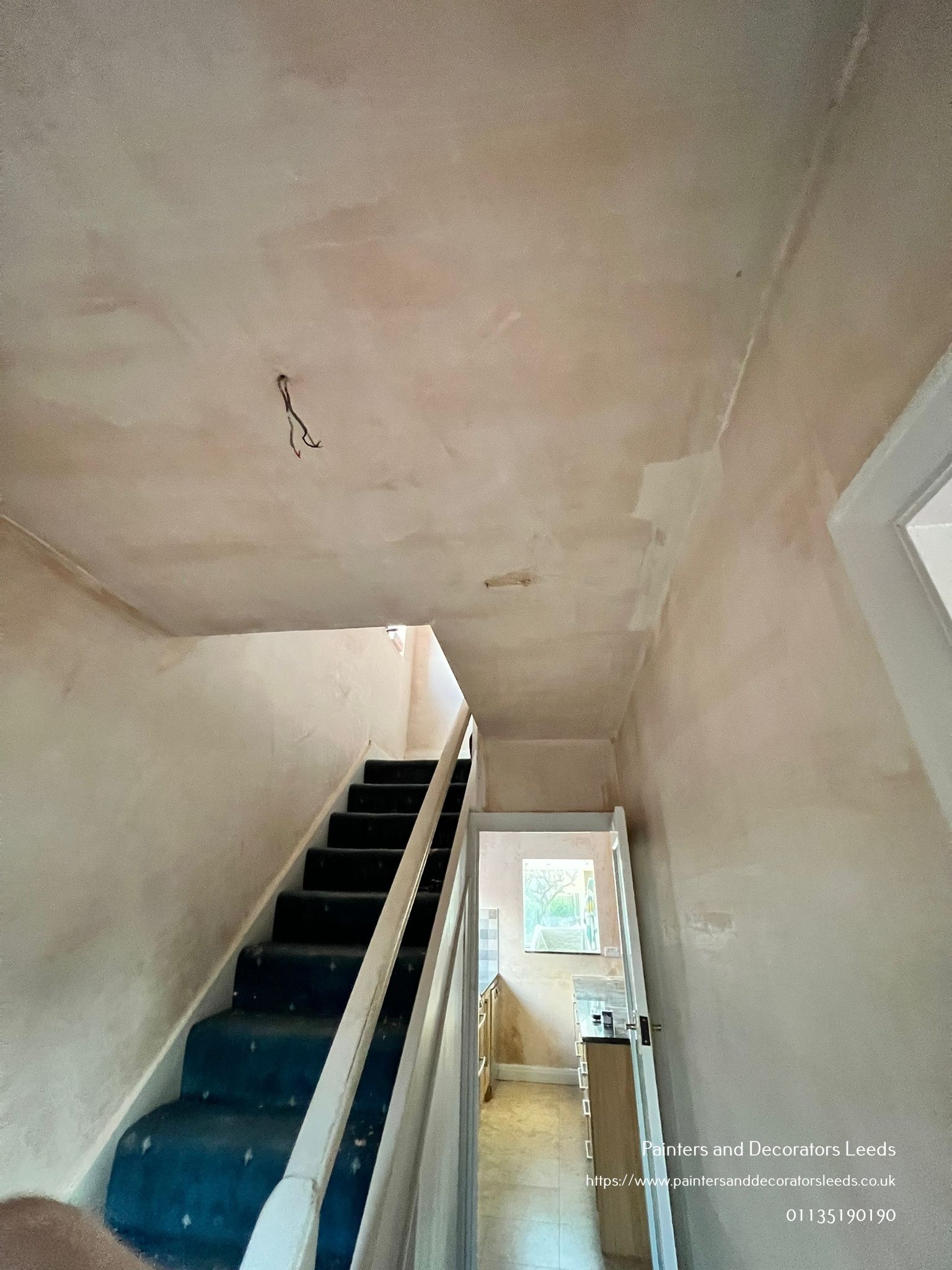 picture of a newly plastered staircase by painters and decorators Leeds
