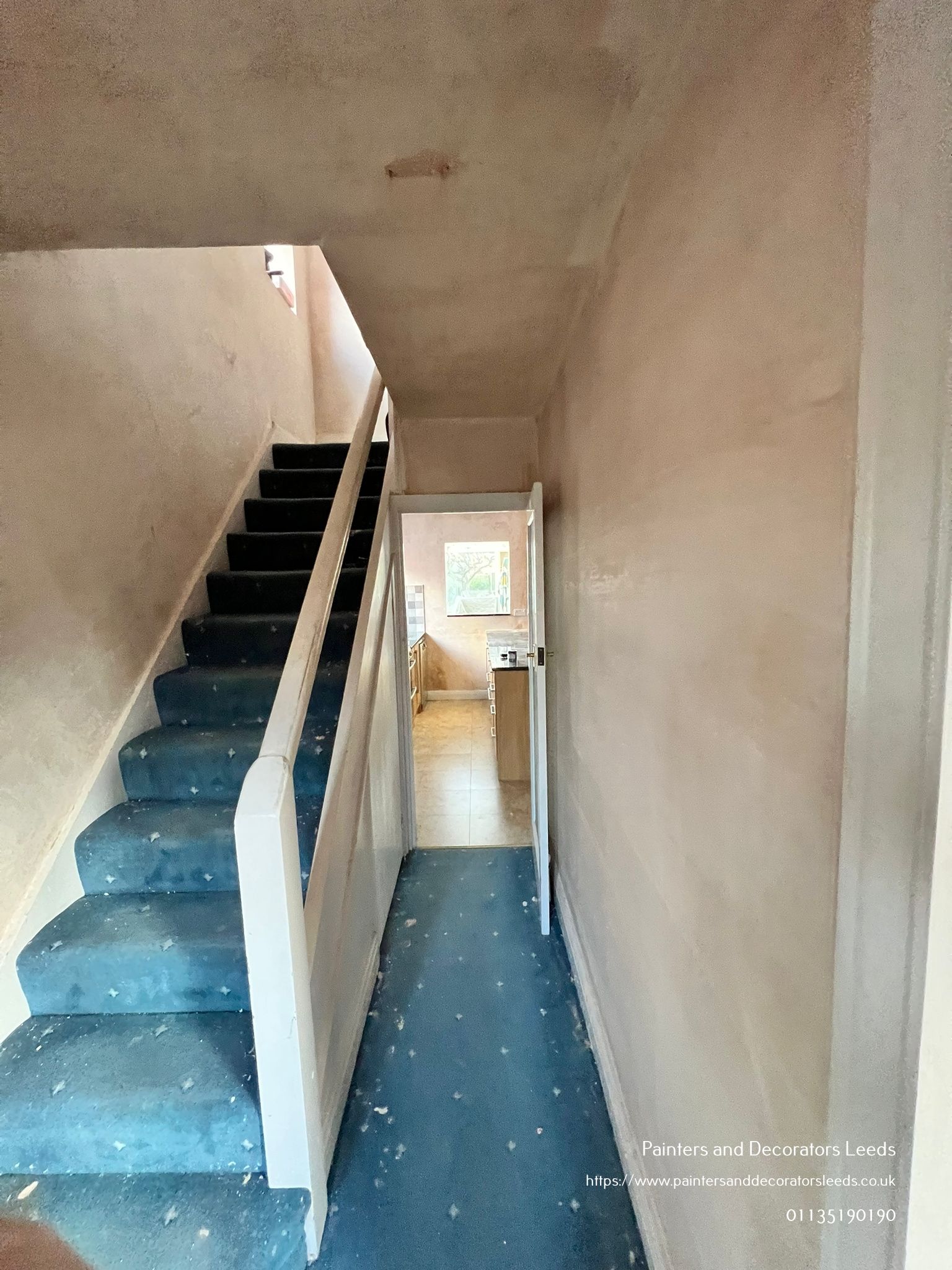 picture of a newly plastered staircase and hallway by painters and decorators Leeds