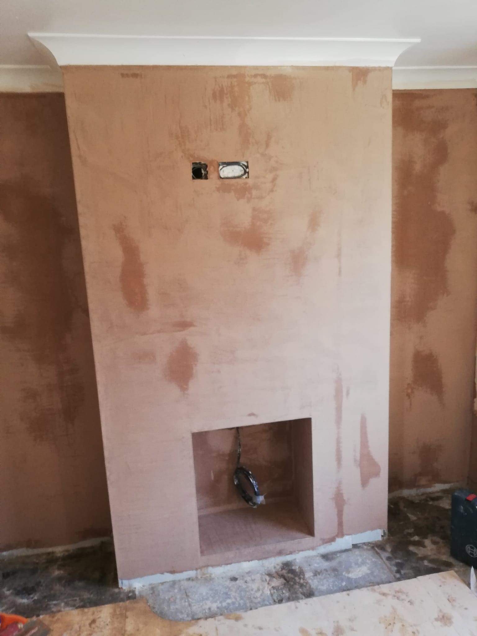 Newly plastered chimney breast wall by plasterers Leeds