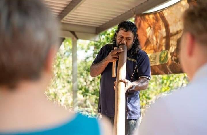 A Performer Demonstrates Playing a Didgeridoo — NT Driver Guide - Escorted Touring & Transfers in Darwin City, NT