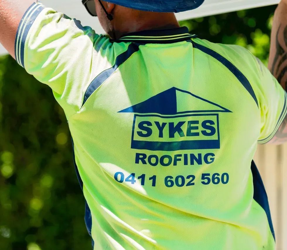 A roofing contractor from Sykes Roofing working on a project in Brisbane.