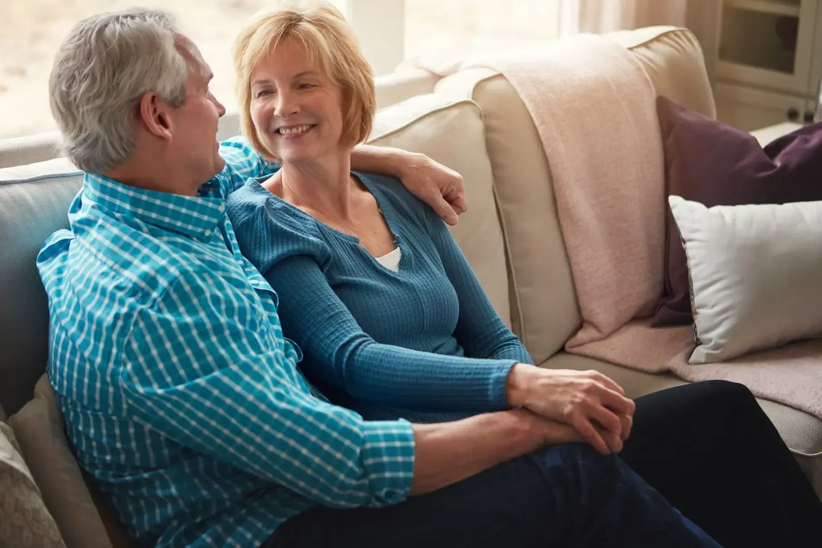 couple in bed facing opposite directions