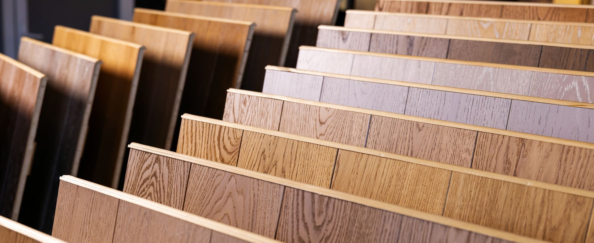 Rows of wood and laminate samples displayed upright in a showroom.