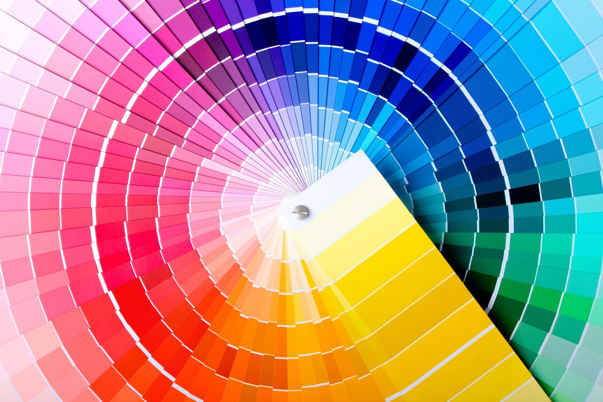 Color wheel fan displaying a wide spectrum of hues from pink to blue.