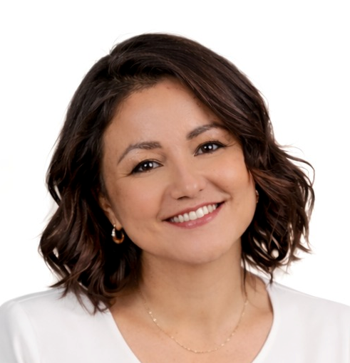 Smiling woman with short dark hair wearing a white top on a white background