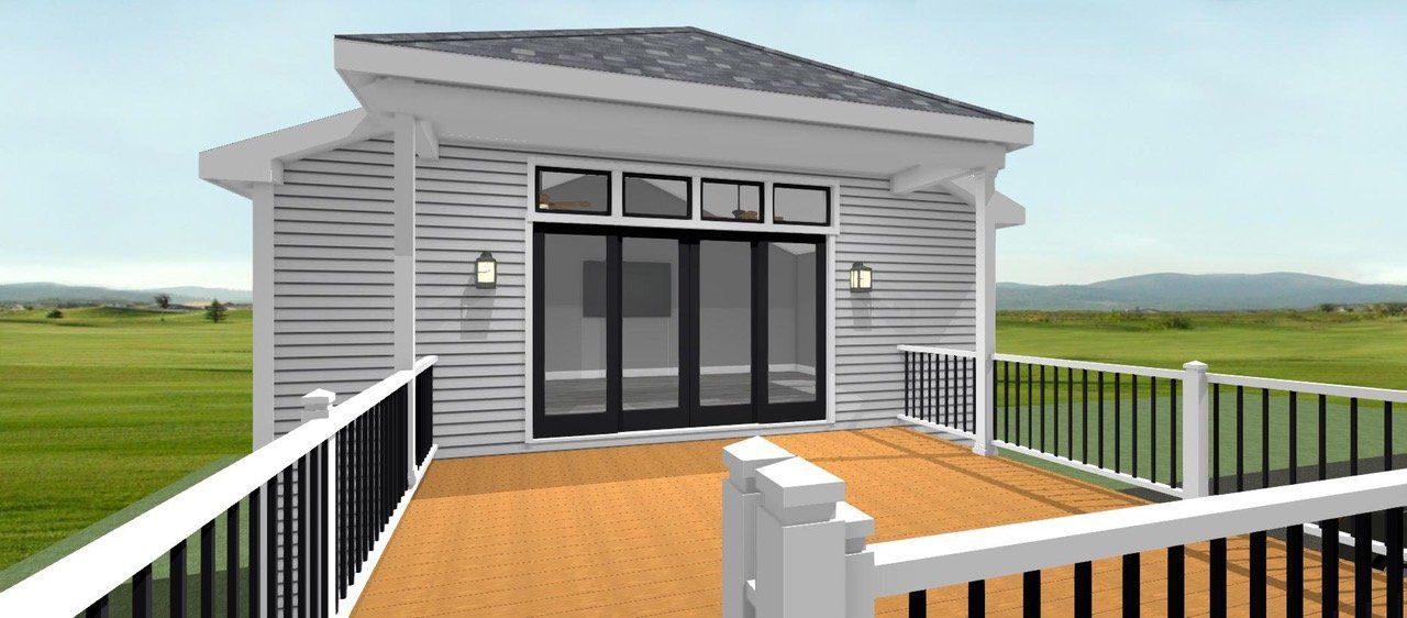 Gray house porch with black double doors, white railings, and a wooden deck overlooking fields